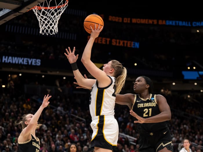 Iowa forward Monika Czinano shoots over Colorado guard Kindyll Wetta and center Aaronette Vonleh during the Sweet 16 of the NCAA women’s tournament.